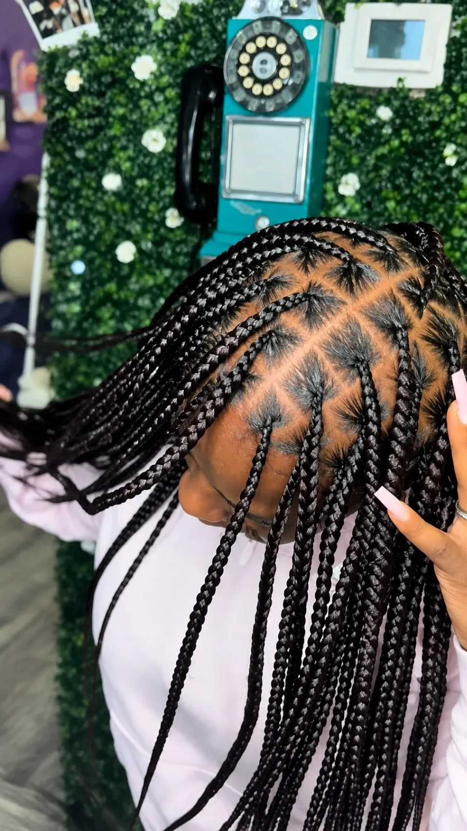 Finished long cornrow braids with a geometric pattern