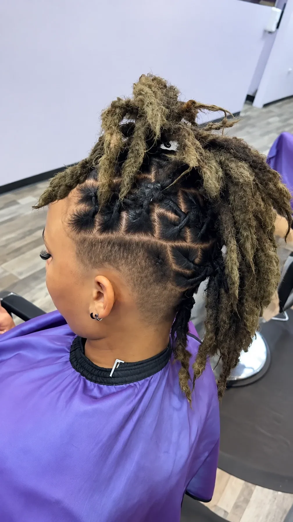 Finished loc style with a high gathered shape